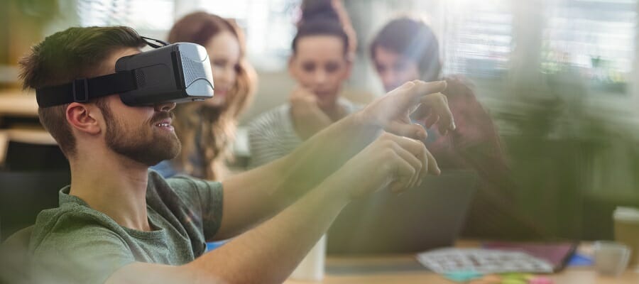 Male business executive using virtual reality headset