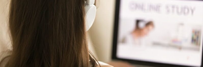 Female student choosing course for distance learn Female student choosing course for distance learn