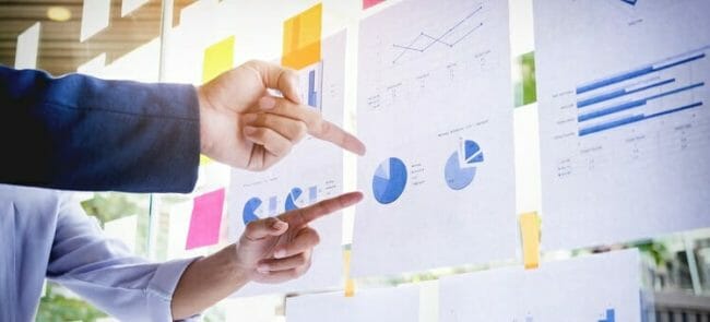 Businessman making presentation with his colleagues and business