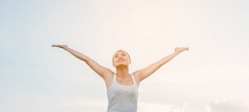 Beautiful Woman feeling free in a beautiful natural setting.