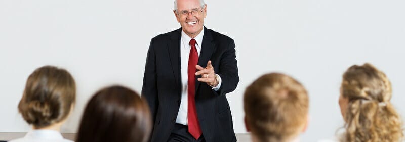 Senior Speaker Communicating with Audience