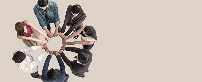 Top view of teen people in team fist bump assemble together.