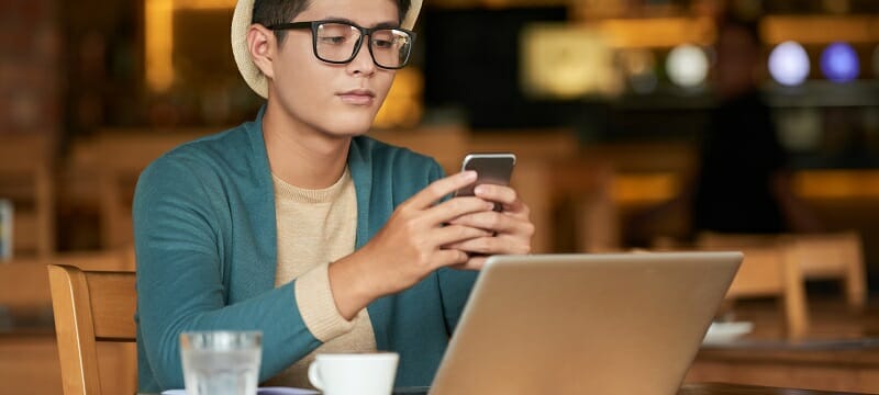 Young man checking phone messages