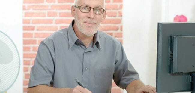 Senior businessman working on computer
