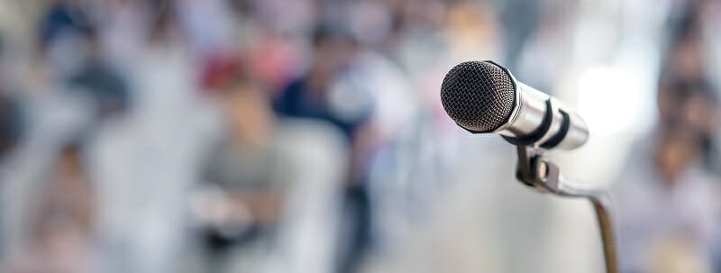 Microphone in front of a large audience