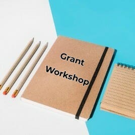 Pencil; closed notebook and spiral notepad on white and blue backdrop